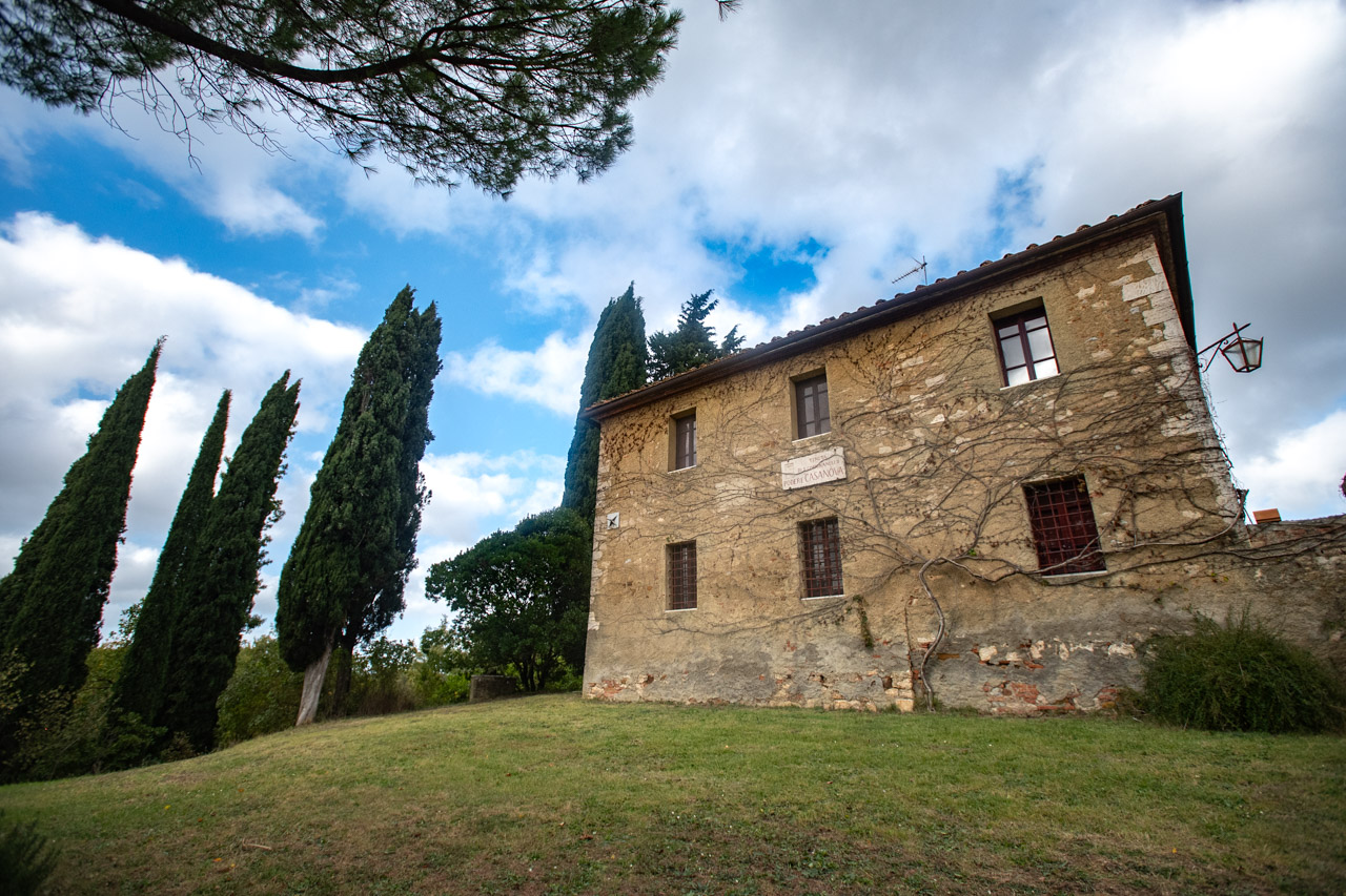 Exterior view of Podere Casanova with cypresses